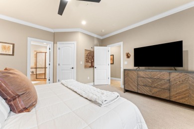 Step into low-maintenance living where the lake is your backdrop