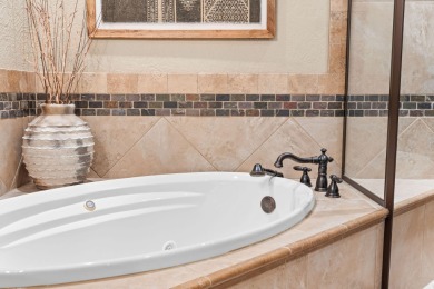 Step into low-maintenance living where the lake is your backdrop