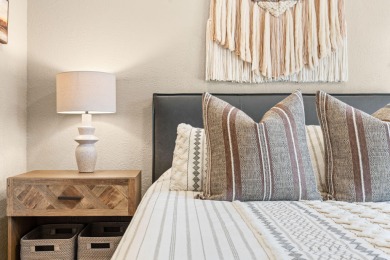 Step into low-maintenance living where the lake is your backdrop