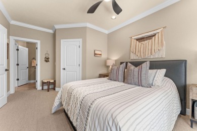 Step into low-maintenance living where the lake is your backdrop