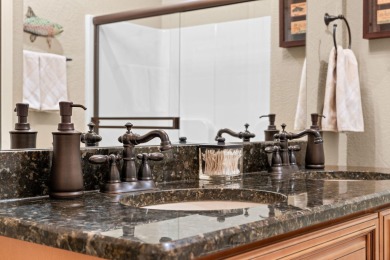 Step into low-maintenance living where the lake is your backdrop