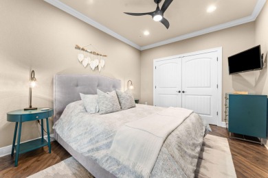 Step into low-maintenance living where the lake is your backdrop