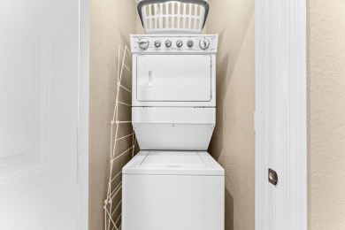 Step into low-maintenance living where the lake is your backdrop