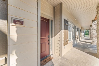 Step into low-maintenance living where the lake is your backdrop