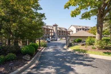 Step into low-maintenance living where the lake is your backdrop