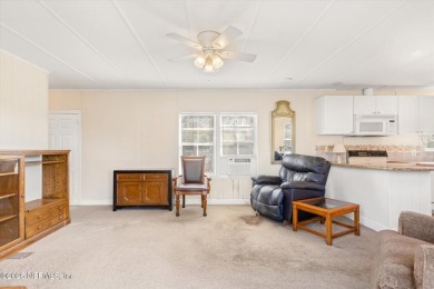 This 938 sq. ft. mobile home offers potential galore! Featuring