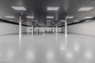 This solidly constructed, three-level commercial building offers