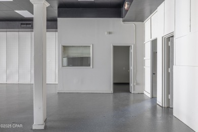 This solidly constructed, three-level commercial building offers