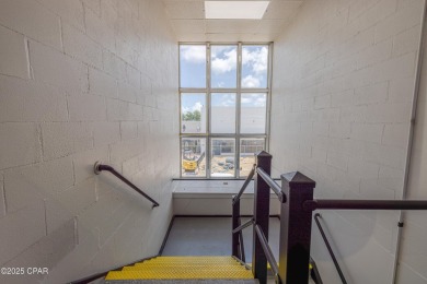 This solidly constructed, three-level commercial building offers