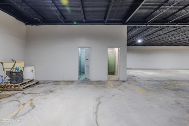 This solidly constructed, three-level commercial building offers