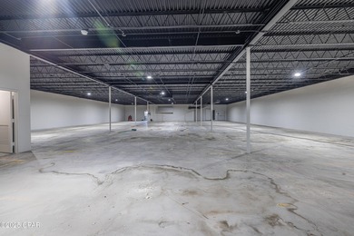 This solidly constructed, three-level commercial building offers