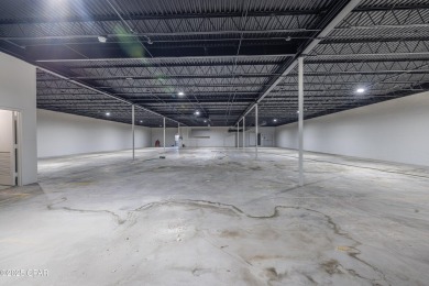 This solidly constructed, three-level commercial building offers