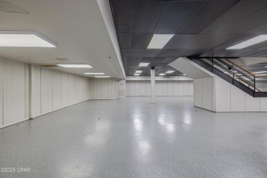 This solidly constructed, three-level commercial building offers