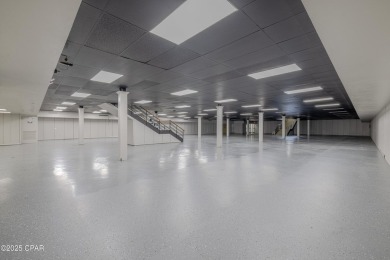 This solidly constructed, three-level commercial building offers