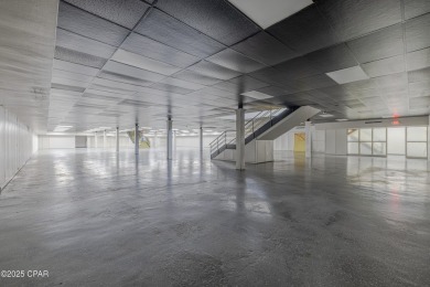 This solidly constructed, three-level commercial building offers