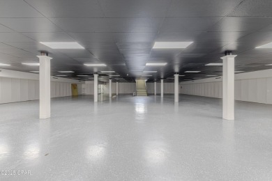 This solidly constructed, three-level commercial building offers