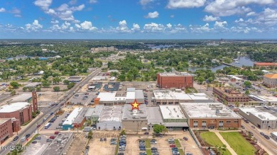 This solidly constructed, three-level commercial building offers