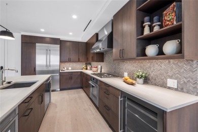 This desirable 2-bedroom, 2-bath residence boasts a coveted