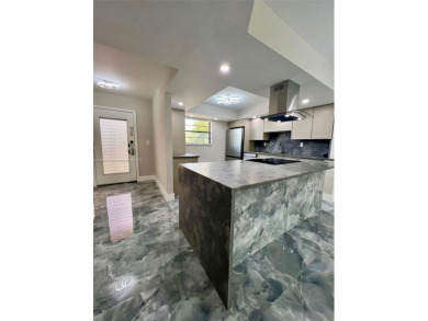 STUNNING HOME IN THE HEART OF TAMARAC. NEW ROOF NEW ELEVATOR ALL