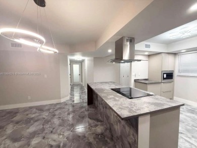 STUNNING HOME IN THE HEART OF TAMARAC. NEW ROOF NEW ELEVATOR ALL