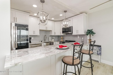 Ocean views from top floor remodeled 2 bed unit in well run Twin