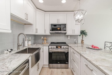 Ocean views from top floor remodeled 2 bed unit in well run Twin