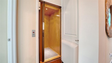 Luxury Coastal Living Awaits you at this beautiful elevated Key