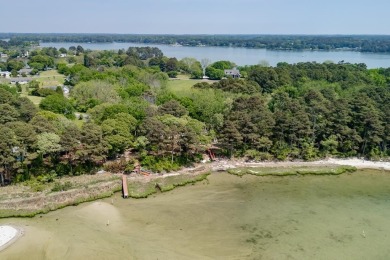 This stunning one-acre bayfront property offers million-dollar