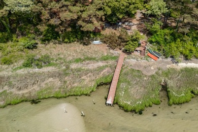 This stunning one-acre bayfront property offers million-dollar