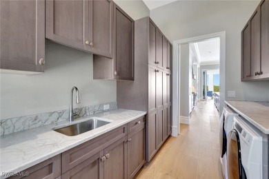 Welcome to 26906 McLaughlin Blvd, a modern coastal masterpiece