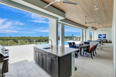 Welcome to 26906 McLaughlin Blvd, a modern coastal masterpiece