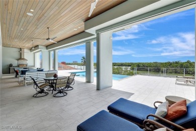 Welcome to 26906 McLaughlin Blvd, a modern coastal masterpiece