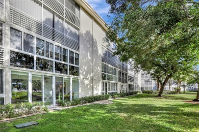 Welcome home to this desirable ground floor condo in one of the