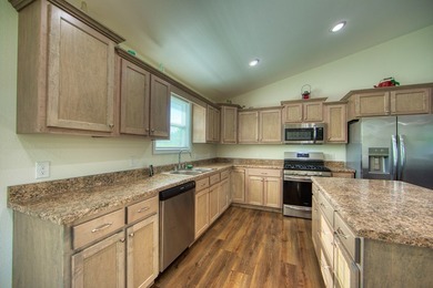 Adorable Modern style home sitting on 1.7 acres. 3 bedrooms/2