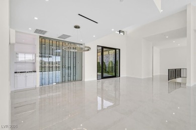 Welcome to 641 Majestic Rim Drive, a modern sanctuary of