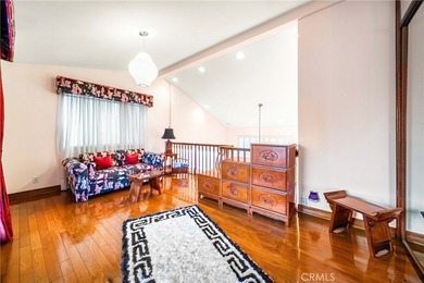 Perched on the top floor with soaring vaulted ceilings and