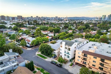 Perched on the top floor with soaring vaulted ceilings and