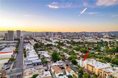 Perched on the top floor with soaring vaulted ceilings and