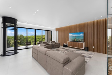 A modern sanctuary on the water, this newly built Key Largo