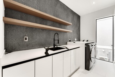 A modern sanctuary on the water, this newly built Key Largo