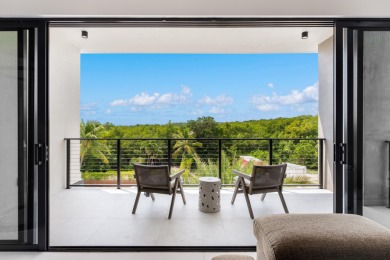 A modern sanctuary on the water, this newly built Key Largo