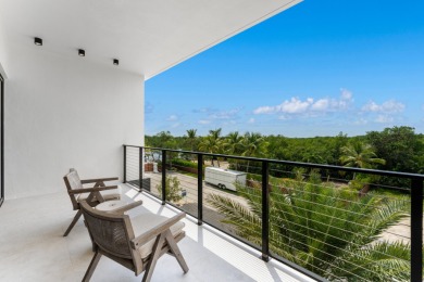A modern sanctuary on the water, this newly built Key Largo