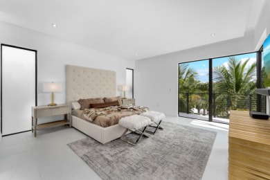 A modern sanctuary on the water, this newly built Key Largo