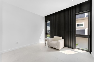 A modern sanctuary on the water, this newly built Key Largo