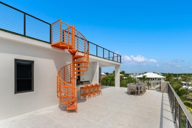 A modern sanctuary on the water, this newly built Key Largo