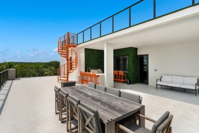 A modern sanctuary on the water, this newly built Key Largo