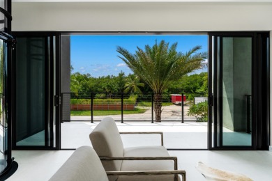 A modern sanctuary on the water, this newly built Key Largo