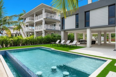A modern sanctuary on the water, this newly built Key Largo