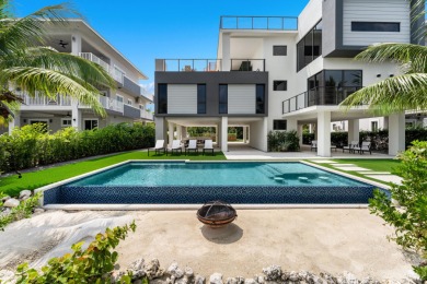 A modern sanctuary on the water, this newly built Key Largo