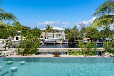 A modern sanctuary on the water, this newly built Key Largo